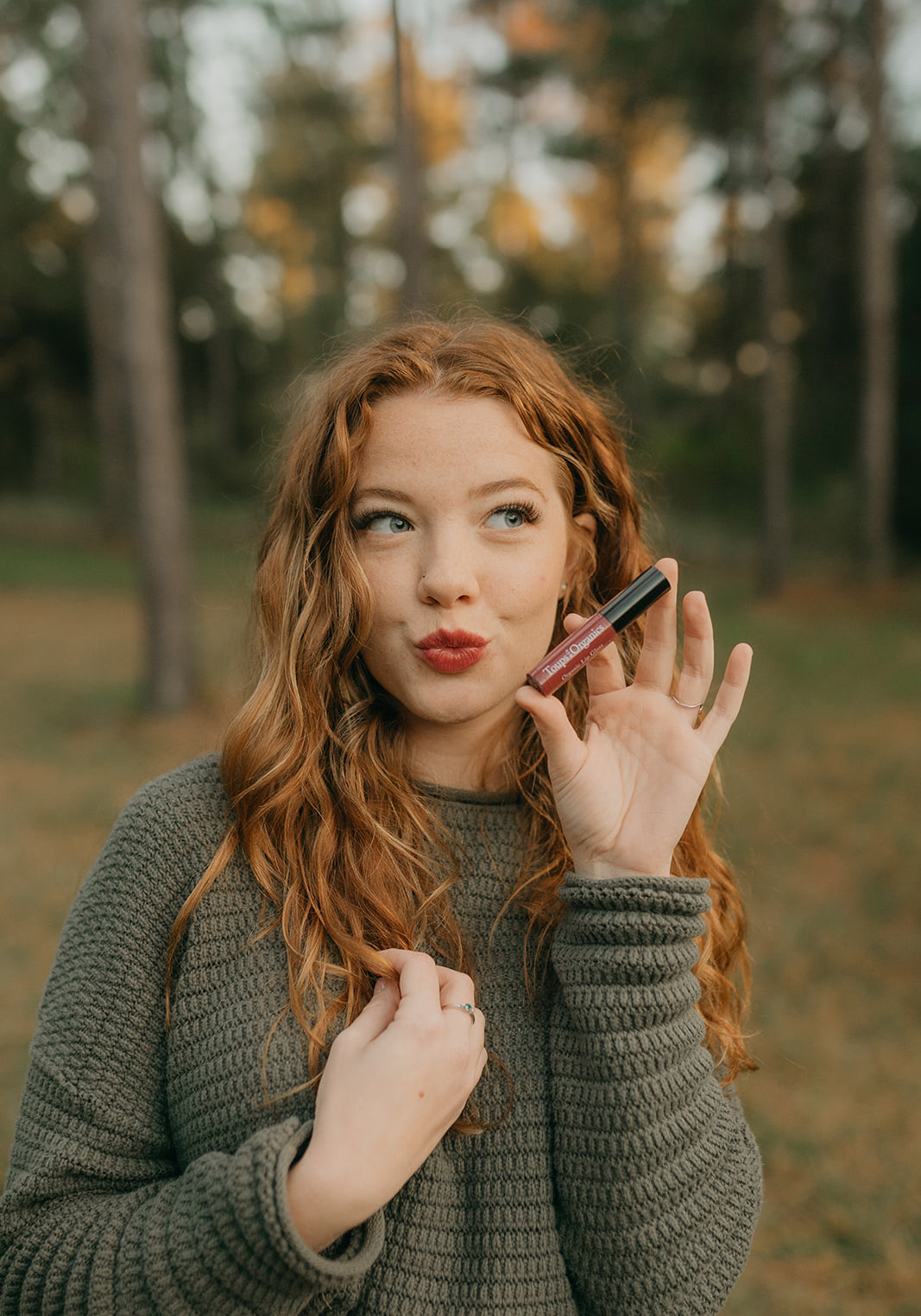 young-woman-shows-off-her-berry-color-nontoxic-lip-gloss