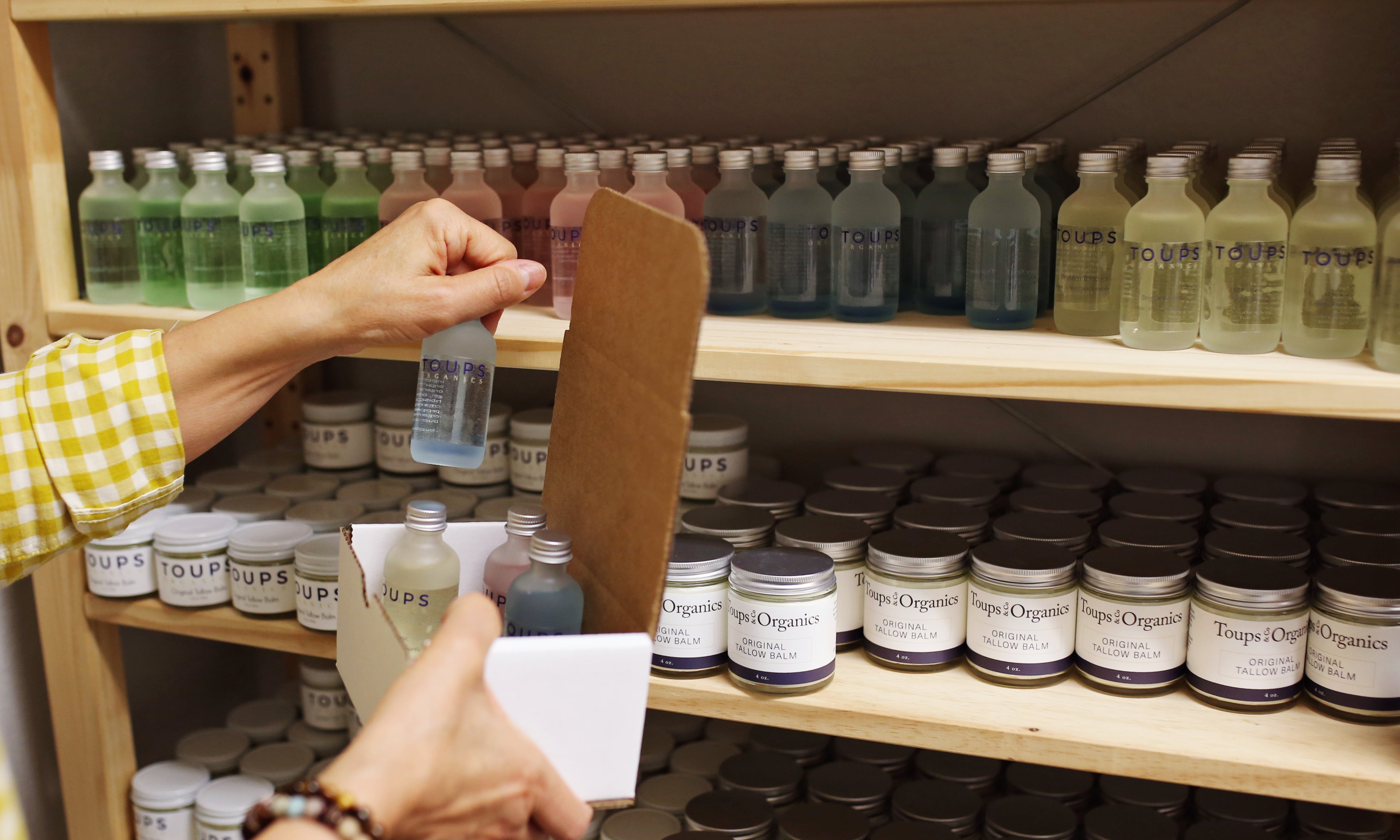 woman-packaging-a-box-of-nontoxic-skincare