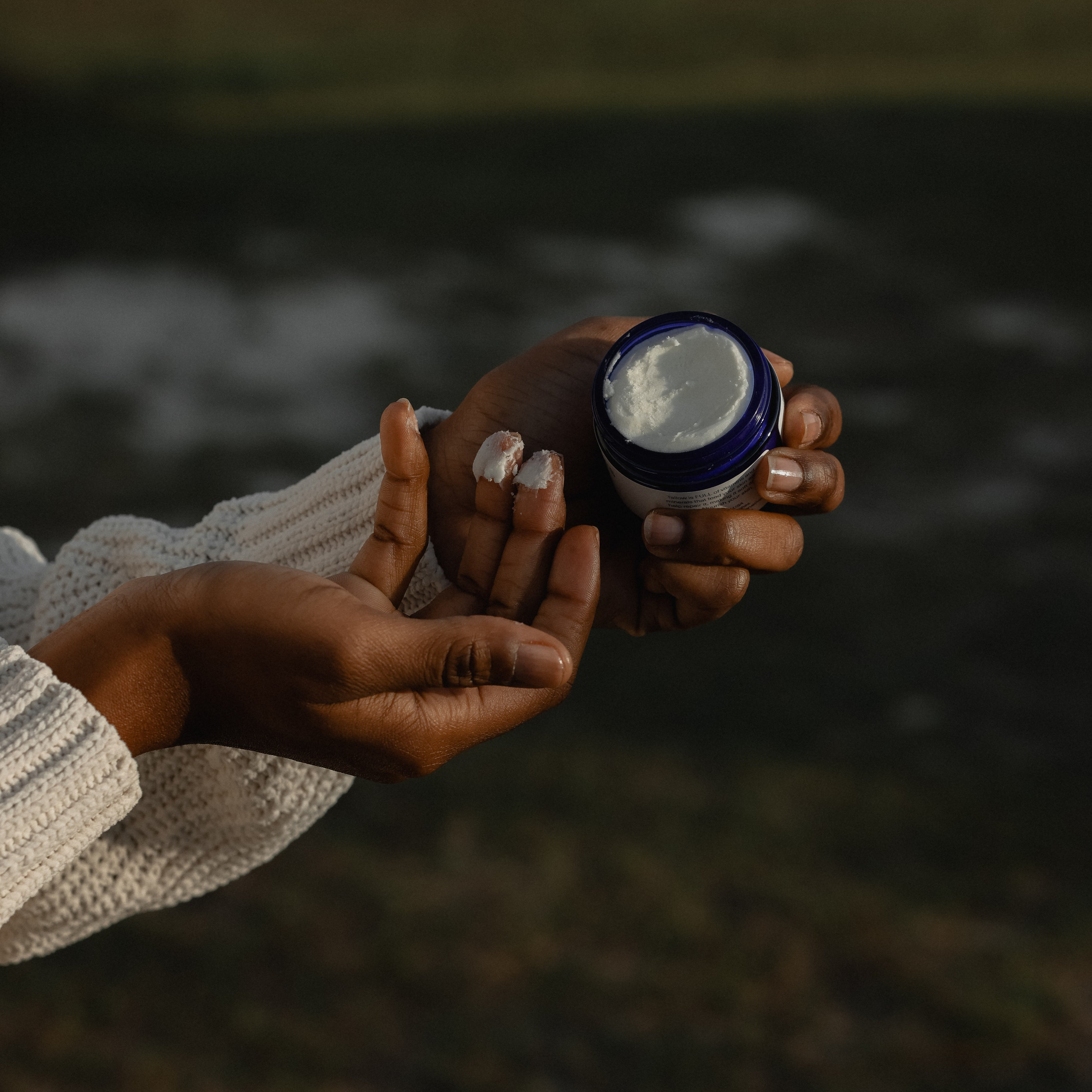 woman-using-tallow-lotion