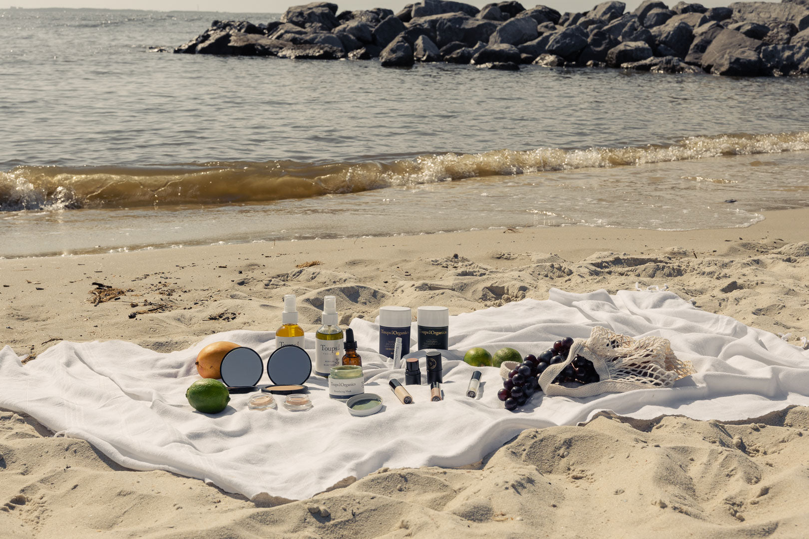 natural-skincare-and-makeup-products-displayed-on-beach