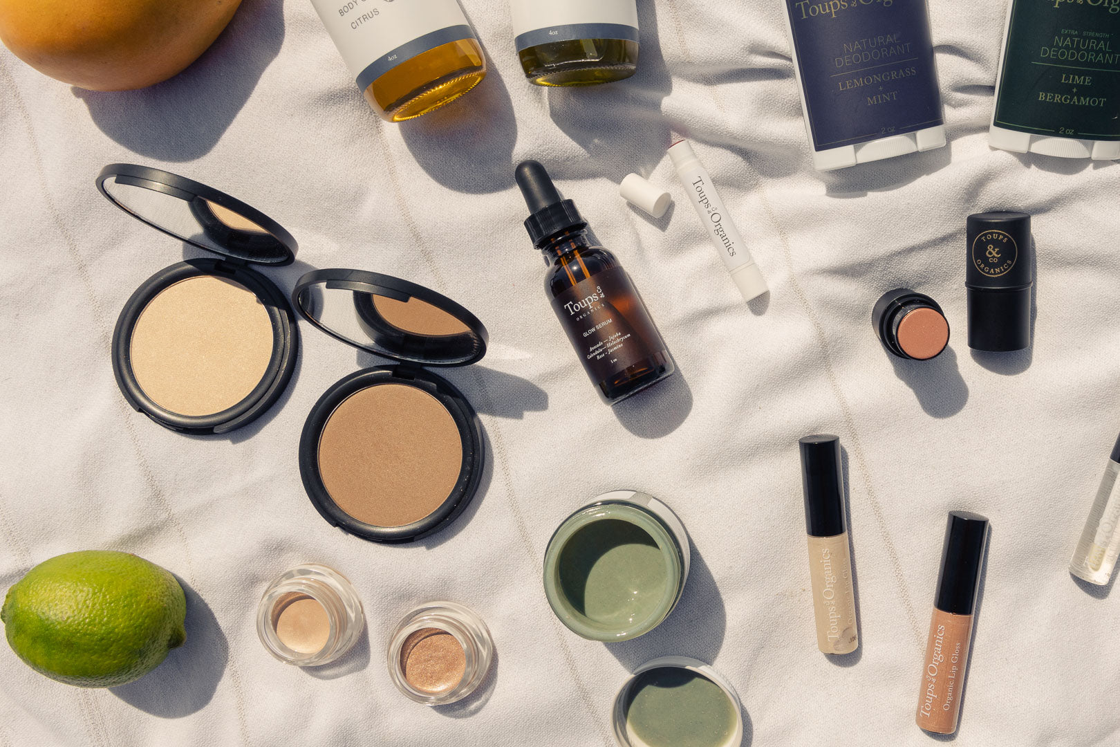 nontoxic-makeup-and-skincare-displayed-on-a-blanket
