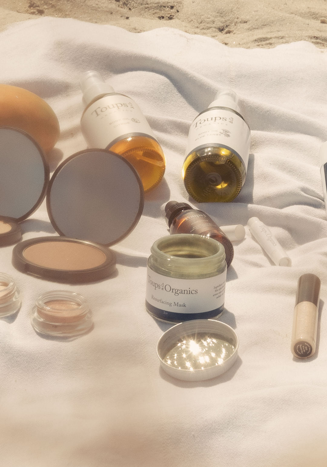 various-natural-skincare-products-displayed-on-a-blanket