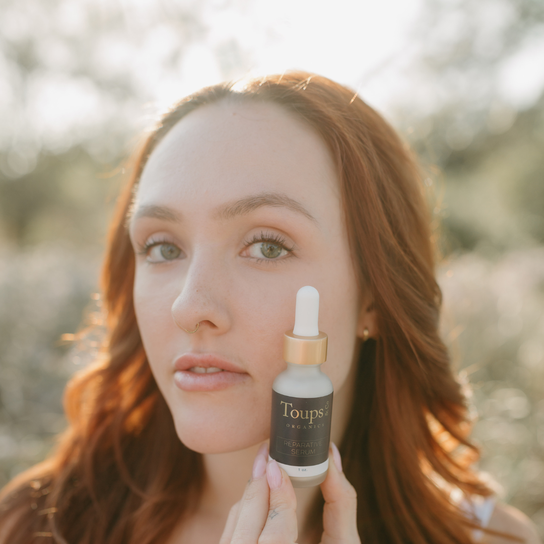 woman-holding-up-bakuchiol-anti-aging-serum