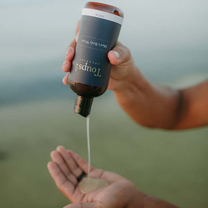 man-squirting-bottle-of-mens-nontoxic-body-wash