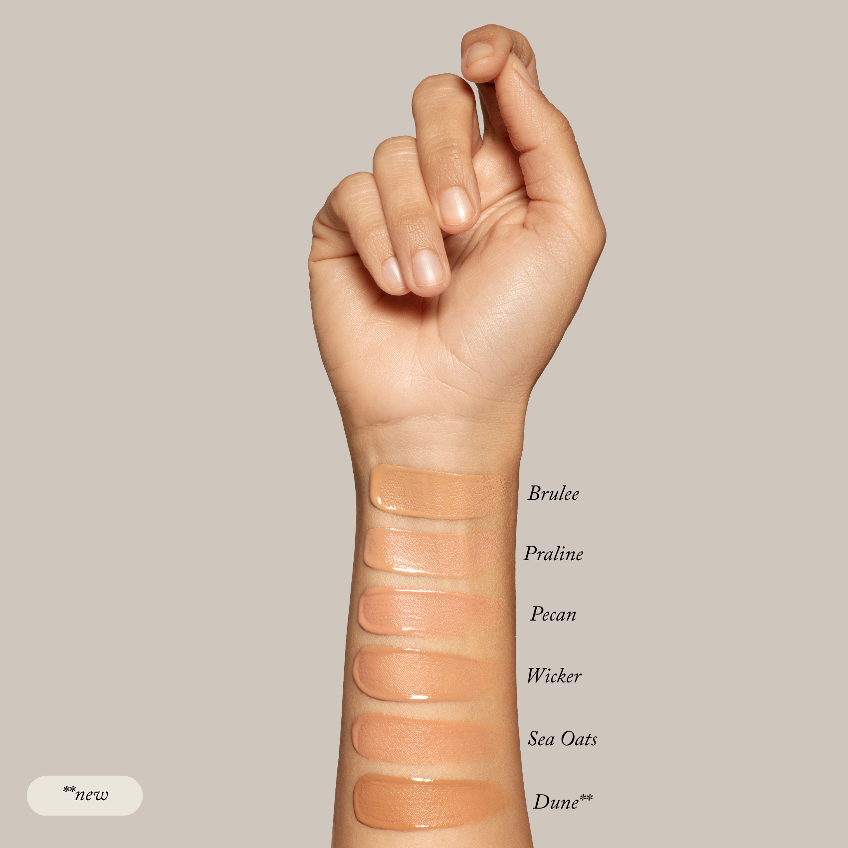 A raised arm displays six Sample Set - Liquid Foundation shades by Toups and Co Organics swatched on the forearm, labeled top to bottom: Brulee, Praline, Pecan, Wicker, Sea Oats, and Dune. Made with all-natural ingredients.