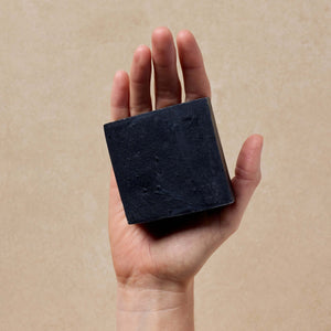 woman-holds-tallow-soap-in-her-hand