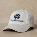 grey-toups-and-co-exclusive-hat-displayed-on-brown-background