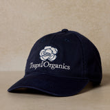 navy-blue-toups-and-co-exclusive-hat-displayed-on-brown-background