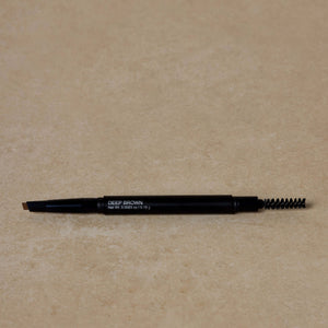 deep-brown-eyebrow-pencil-displayed-on-brown-background-with-eyebrow-brush-on-one-end