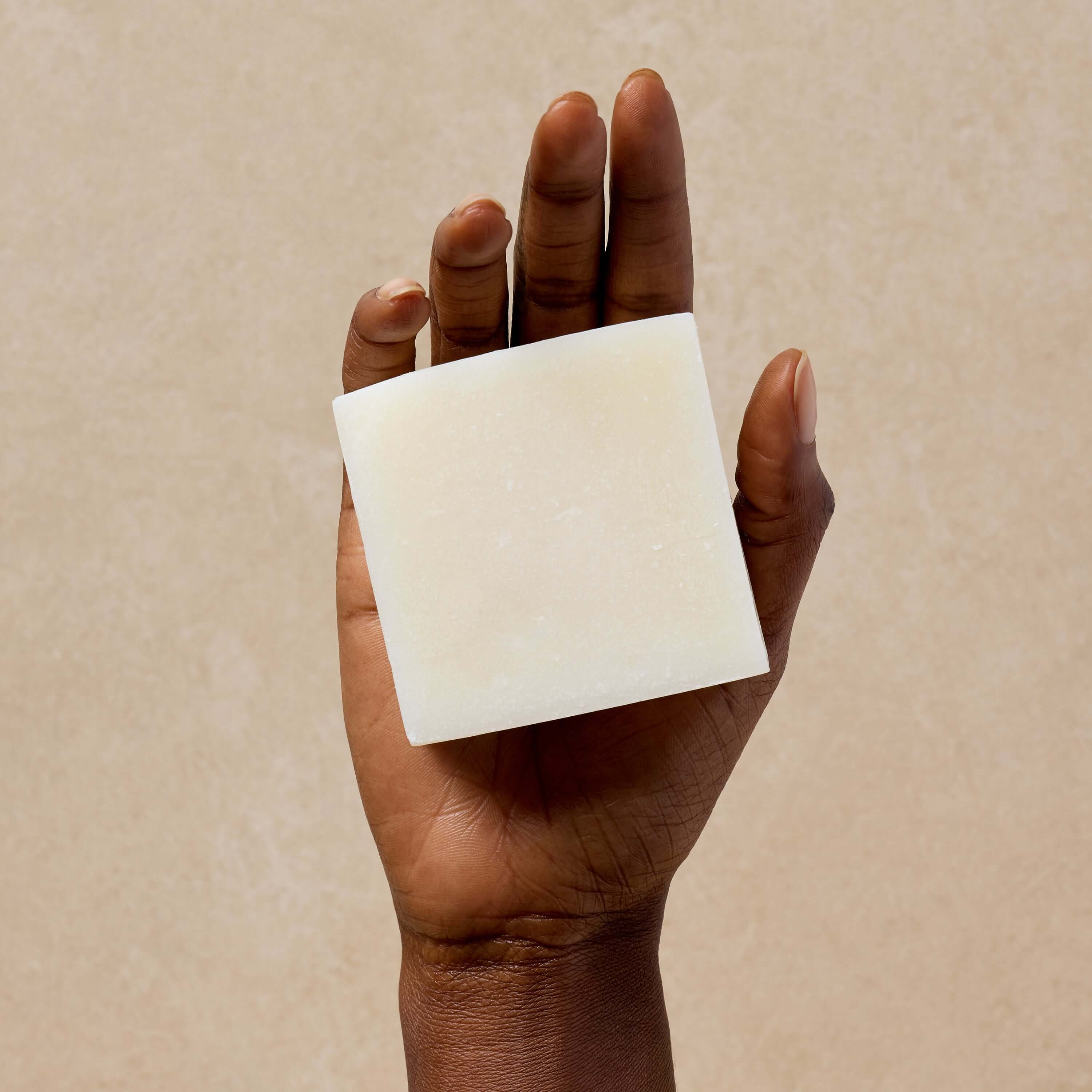 woman-holds-coconut-oil-soap