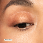 Close-up of a persons eye with Toups and Co Organics Natural Eyeshadow Singles in Antique Penny swept over the lid, creating a radiant copper look.