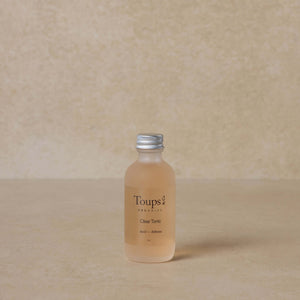 facial-tonic-for-acne-with-brown-background