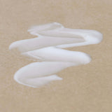 textured-photo-of-nontoxic-face-primer-on-brown-surface