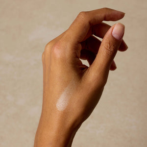 woman-shows-swatch-of-nontoxic-makeup-highlighter-on-her-arm