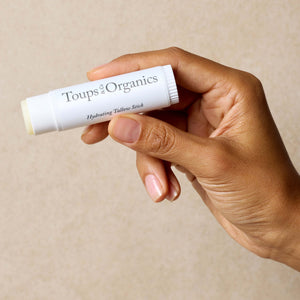woman-holds-up-tallow-balm-stick
