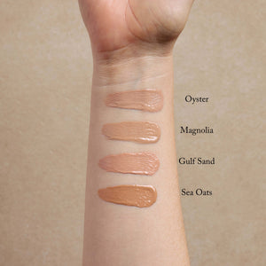 four-light-shades-of-nontoxic-primer-swatched-on-a-womans-arm
