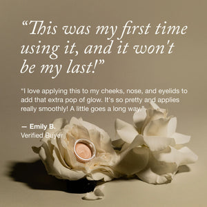 Customer review for a glow balm, featuring a testimonial from Emily B. and a small jar of product nestled between two white roses.