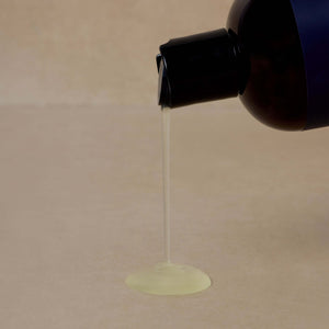textured-photo-of-nontoxic-mens-body-wash-poured-onto-brown-surface