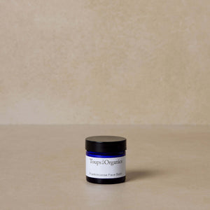 mini-frankincense-tallow-balm-displayed-on-brown-background