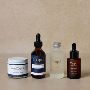 nontoxic-skincare-routine-set-with-brightening-toner-displayed-on-brown-background