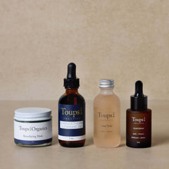 nontoxic-skincare-routine-set-with-acne-toner-displayed-on-brown-background