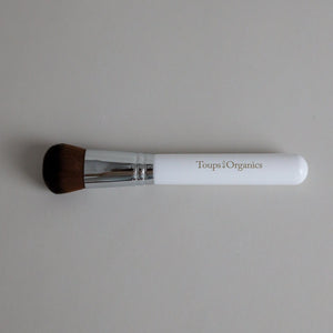 Toups & Co non-toxic makeup brush with white handle for buffing mineral foundation