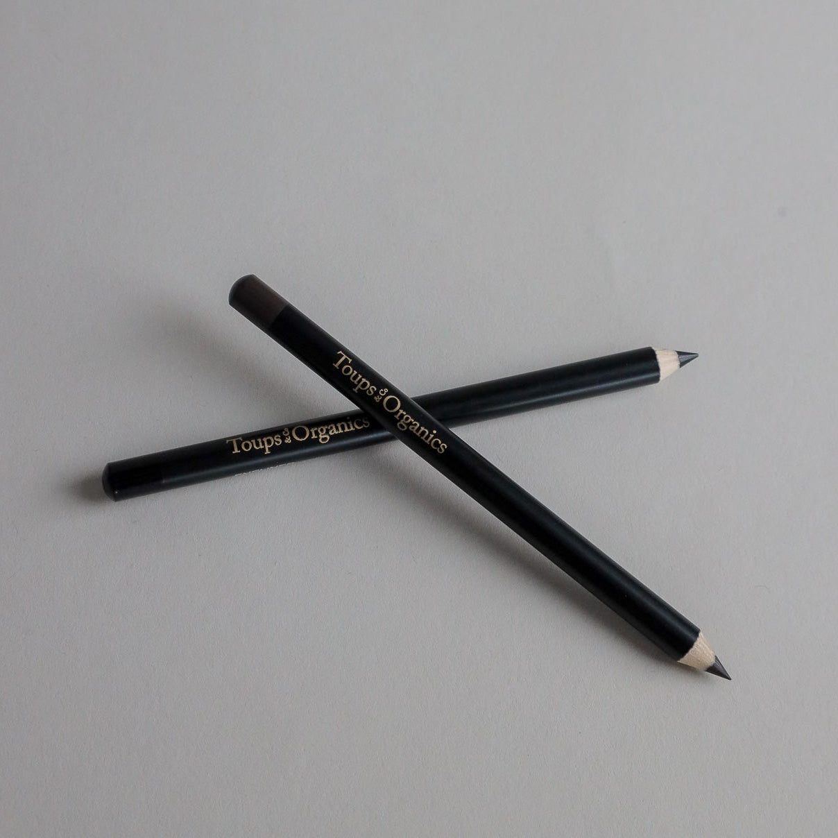 Toups & Co non-toxic eyeliner pencils, sharpened tips crossed