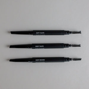 Toups & Co non-toxic brow pencils in Soft Taupe, Deep Taupe, and Deep Brown with spoolie brush