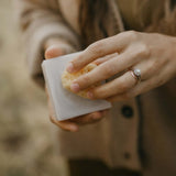 woman-lathers-soap-with-facial-sea-sponge