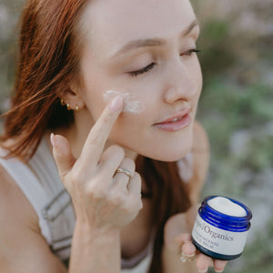 woman-applies-tallow-balm-for-face-to-her-cheeks